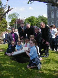 Archbishop Josiah, Mr Maguire (Belleek Pottery), Fr Lonergan, Bishop Jackson, and Rev Regan with Belleek school children