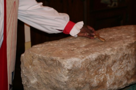 The Archbishop of York places his cross at the Clogher stone